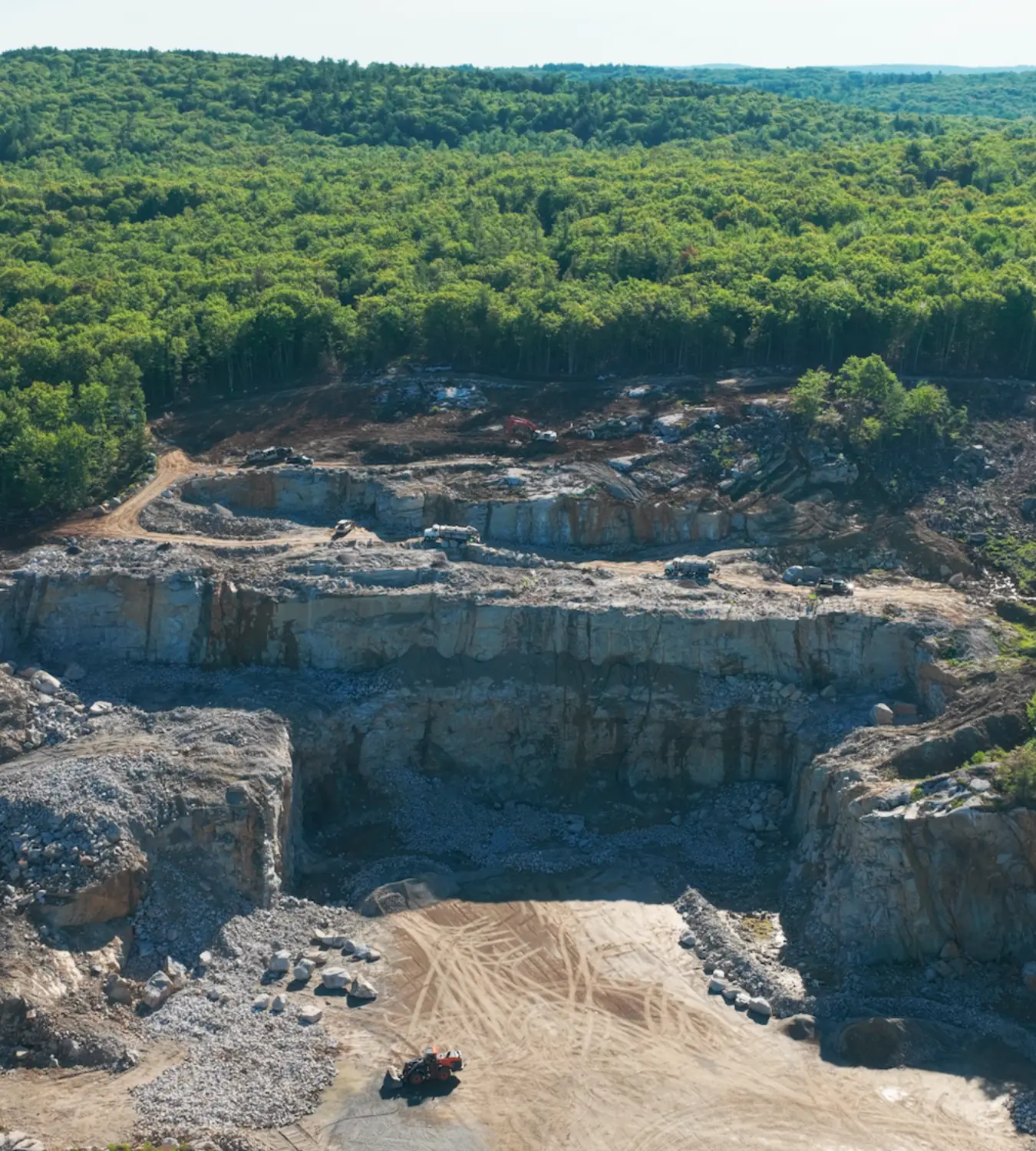 Commercial pad and sitework rock drilling
