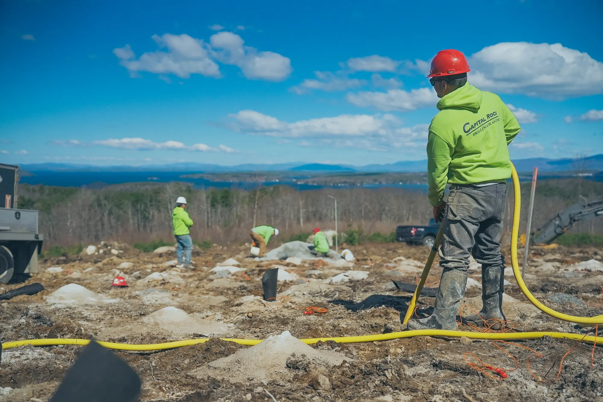 Crew preparing a rocky work site