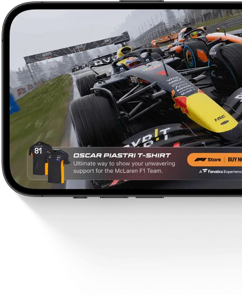 Smartphone screen showing a racing scene with Formula 1 cars in wet conditions and an ad for Oscar Piastri McLaren F1 team t-shirt.