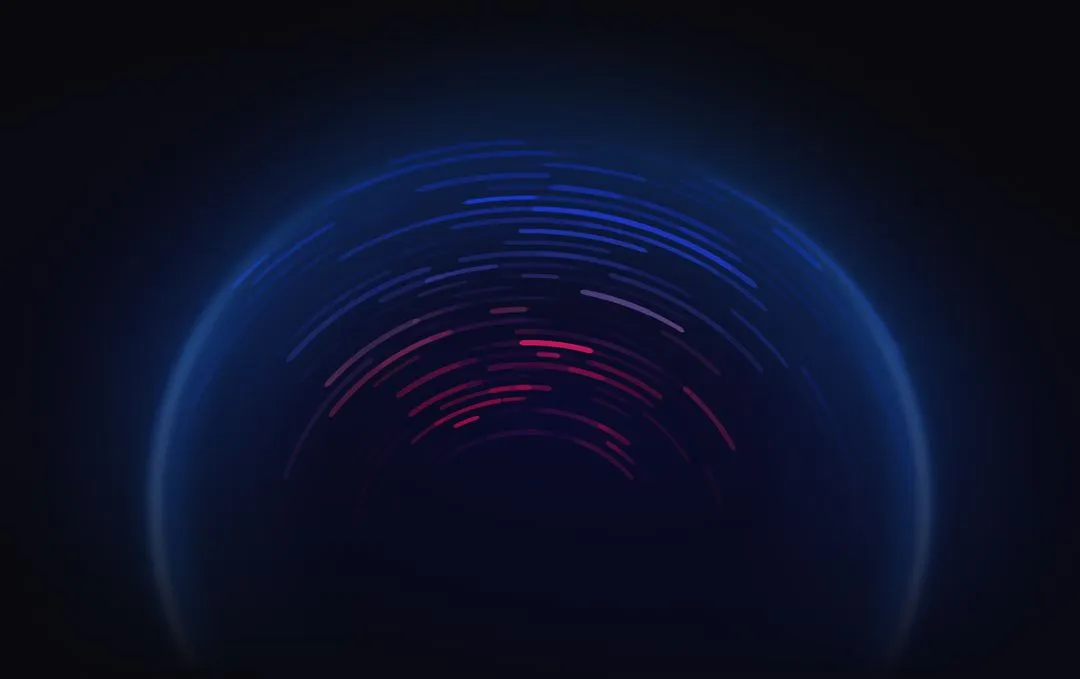 Glowing blue sphere with swirling red and blue light trails above its surface on a dark background.