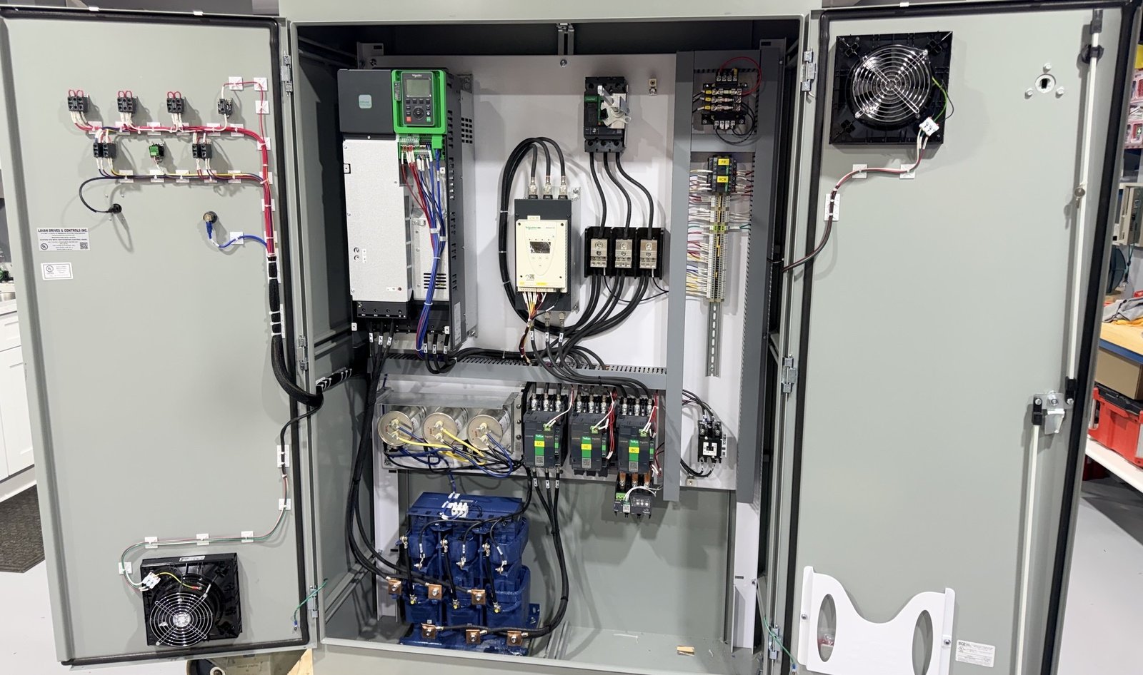 Integrated electrical control cabinet with drives, controls, and communications hardware