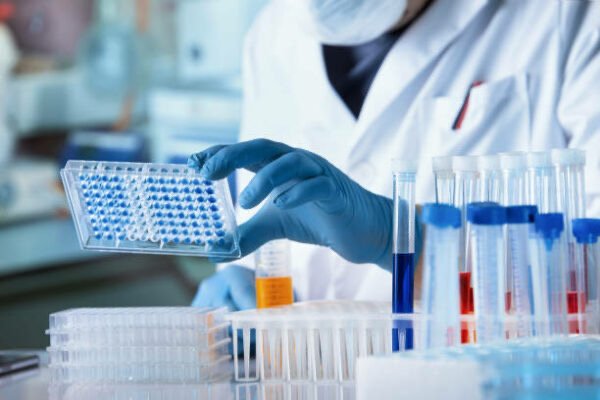 Laboratory technician working with samples in a life-sciences facility