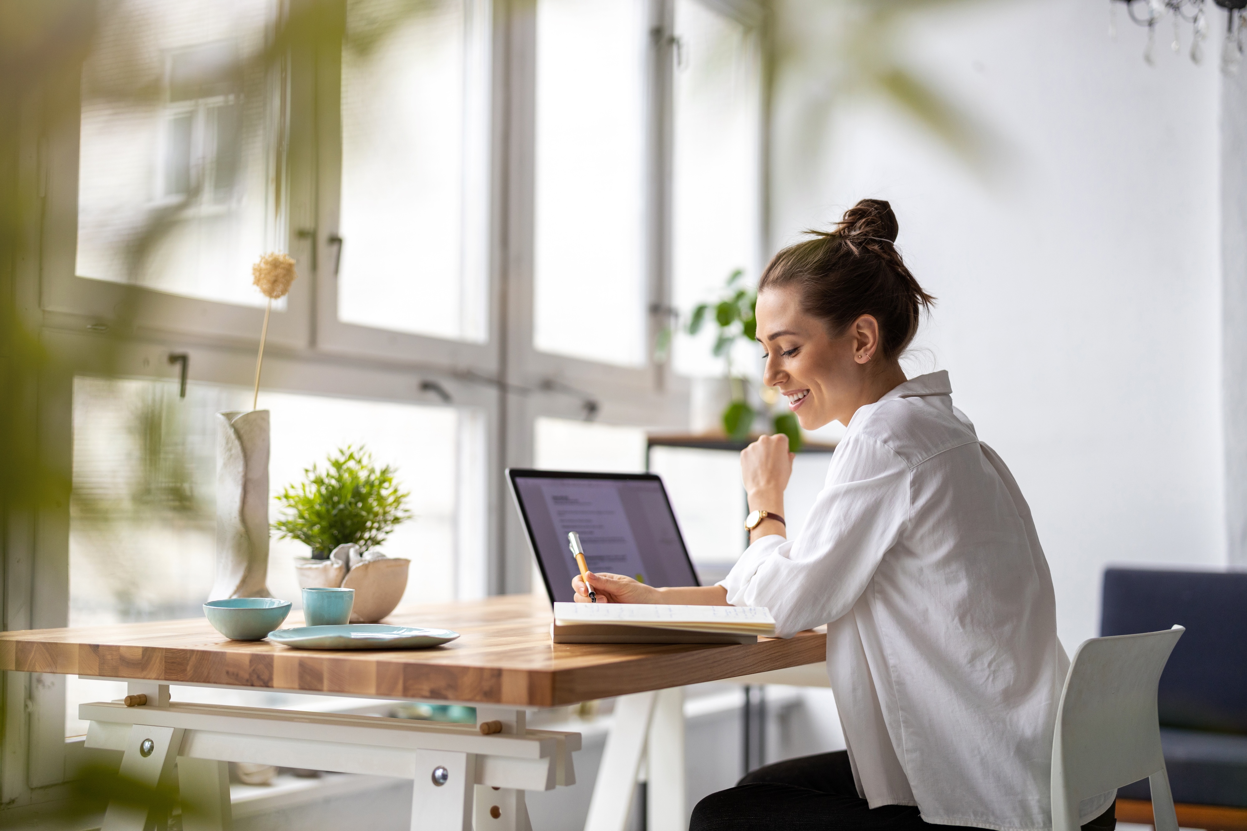 Woman working at desk stock image