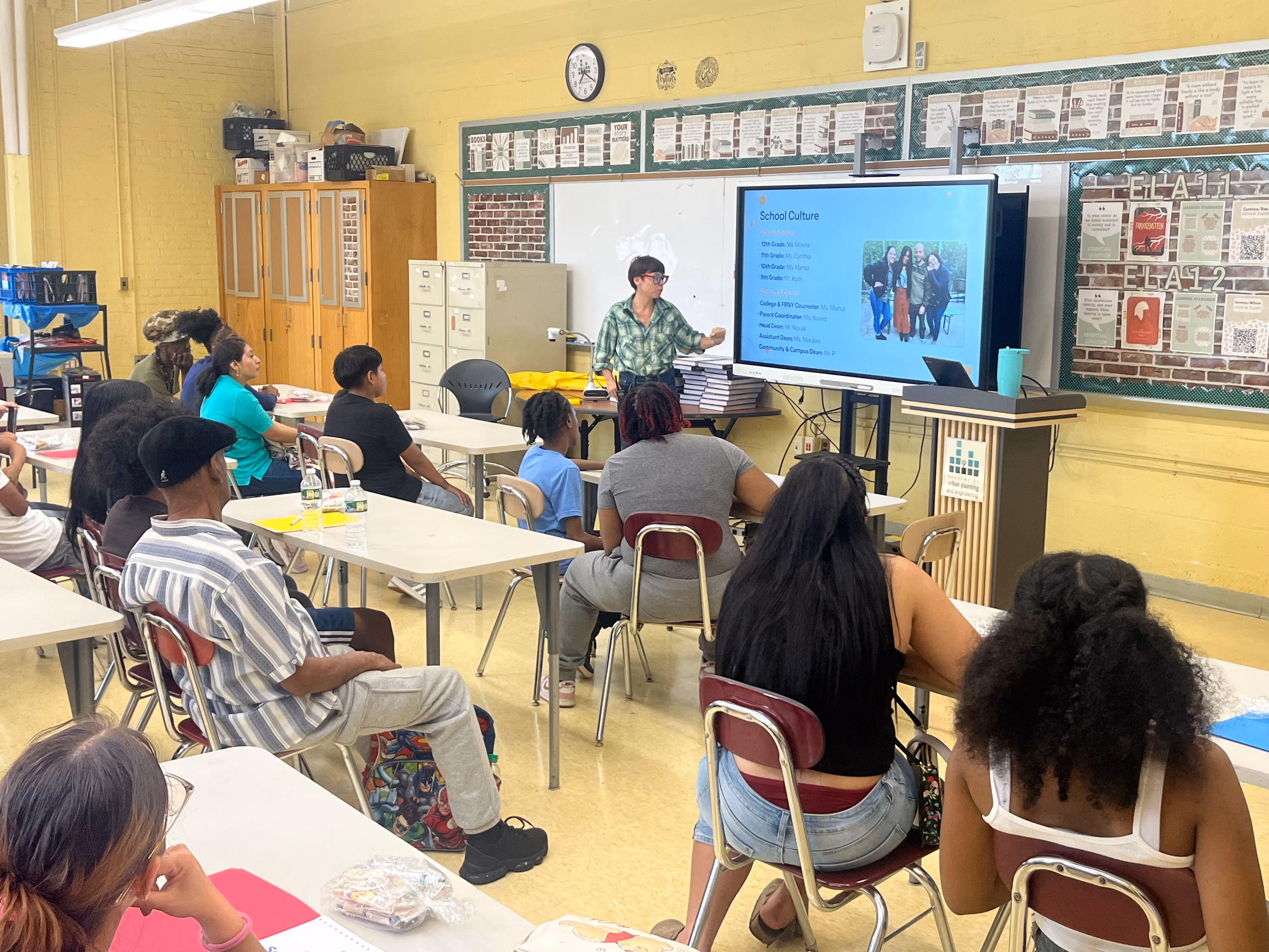 Teacher presenting School Culture slideshow to students and families