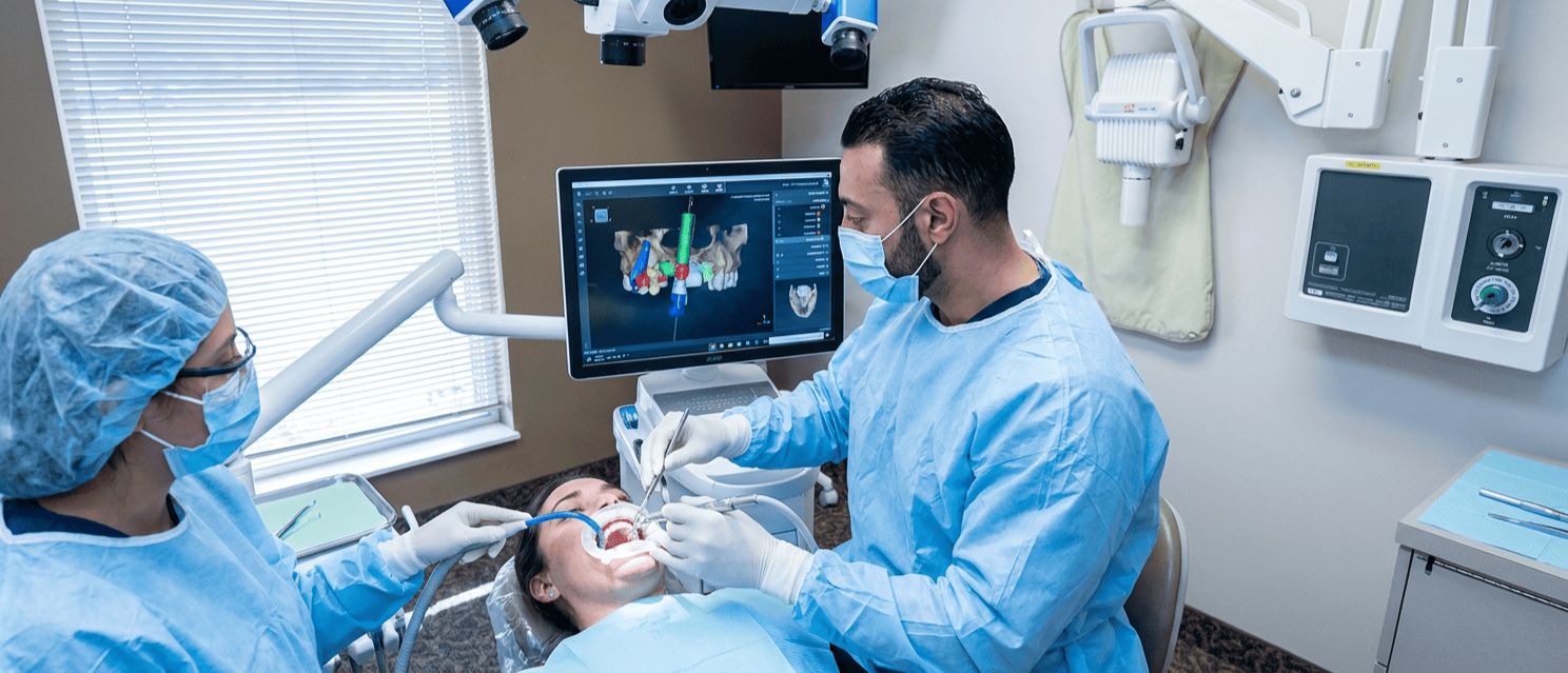 Dr. Khaddor performs computer-guided All-on-X dental implant placement with an assistant and navigation system.