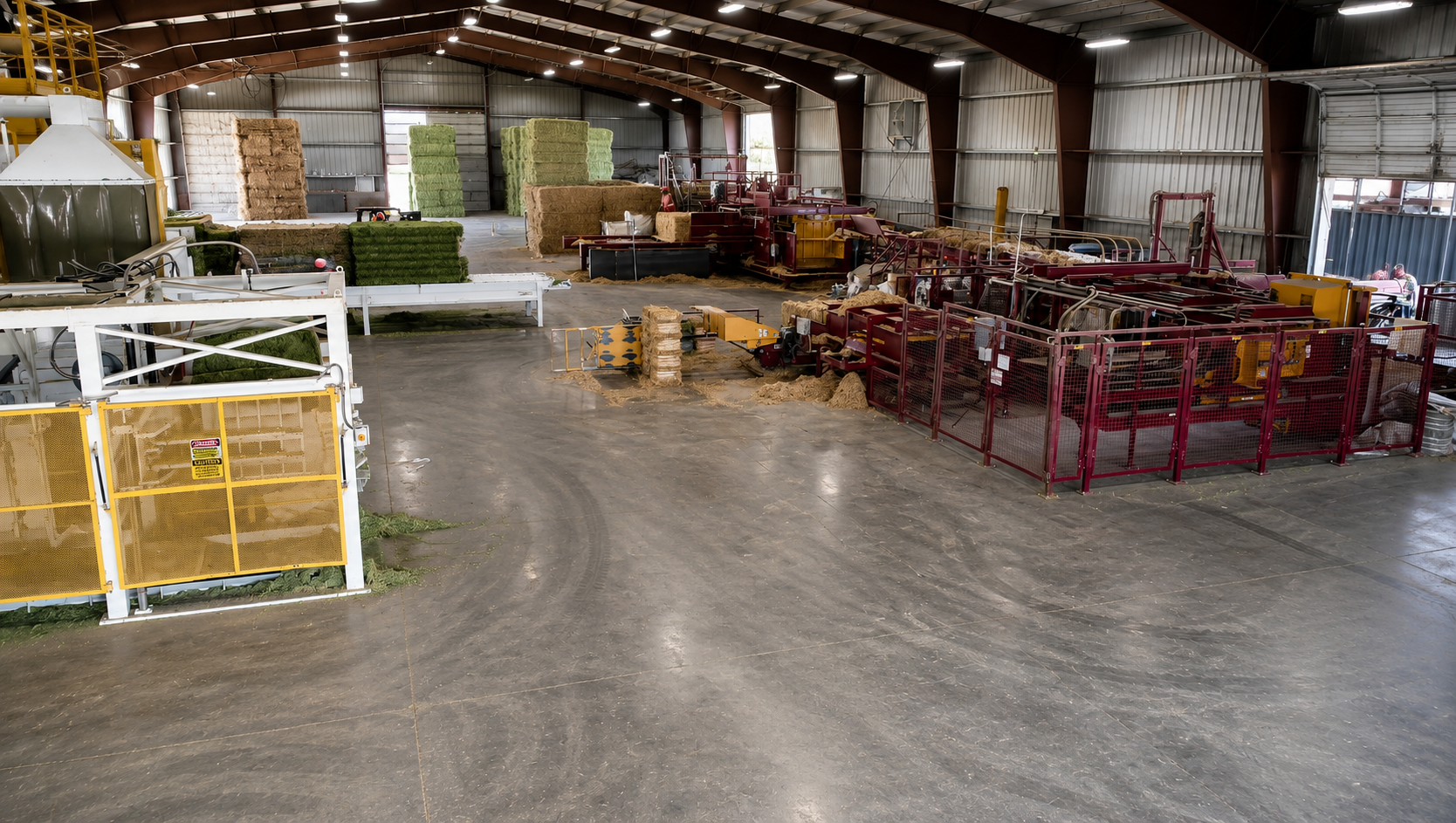 Interior of the Stone Wings II processing facility with baled hay and packaging equipment