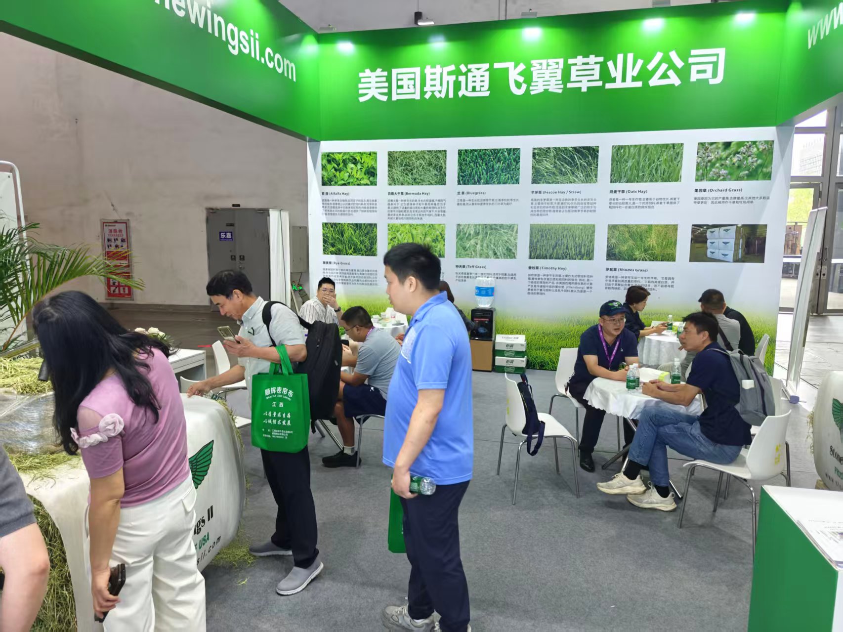 Crowd of visitors gathered at the Stone Wings II trade show booth