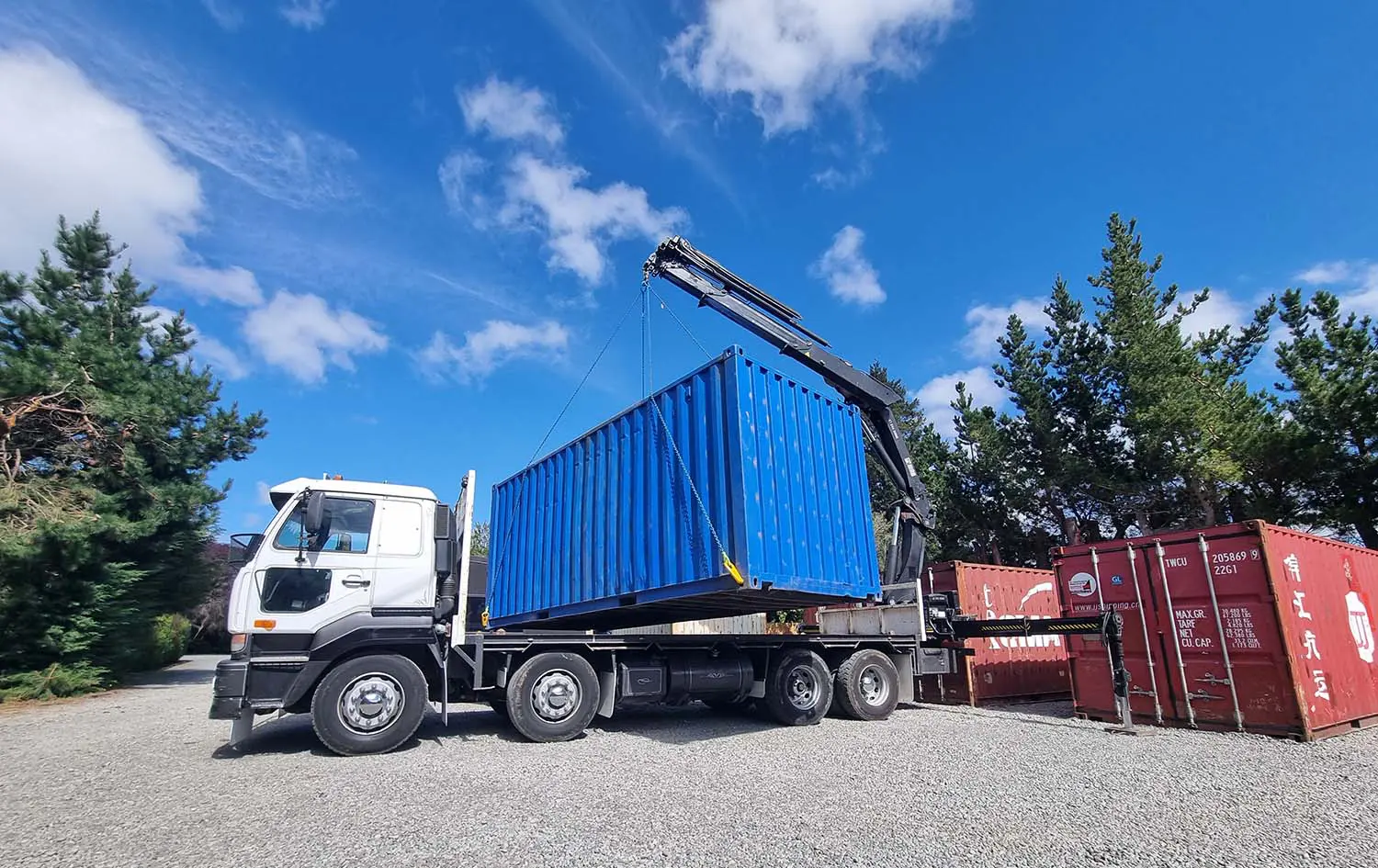 A real blue container and local HIAB transport capability