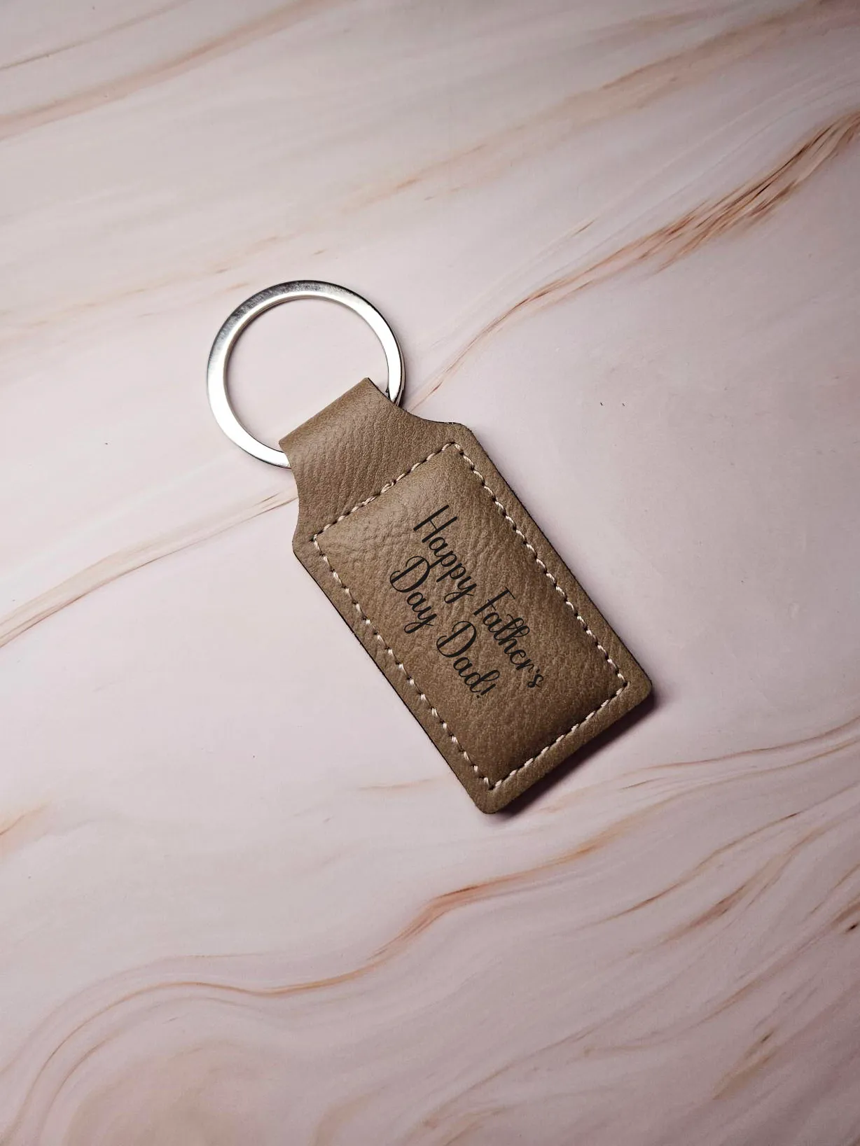 Tan leather keyring engraved with a personalised Father's Day message