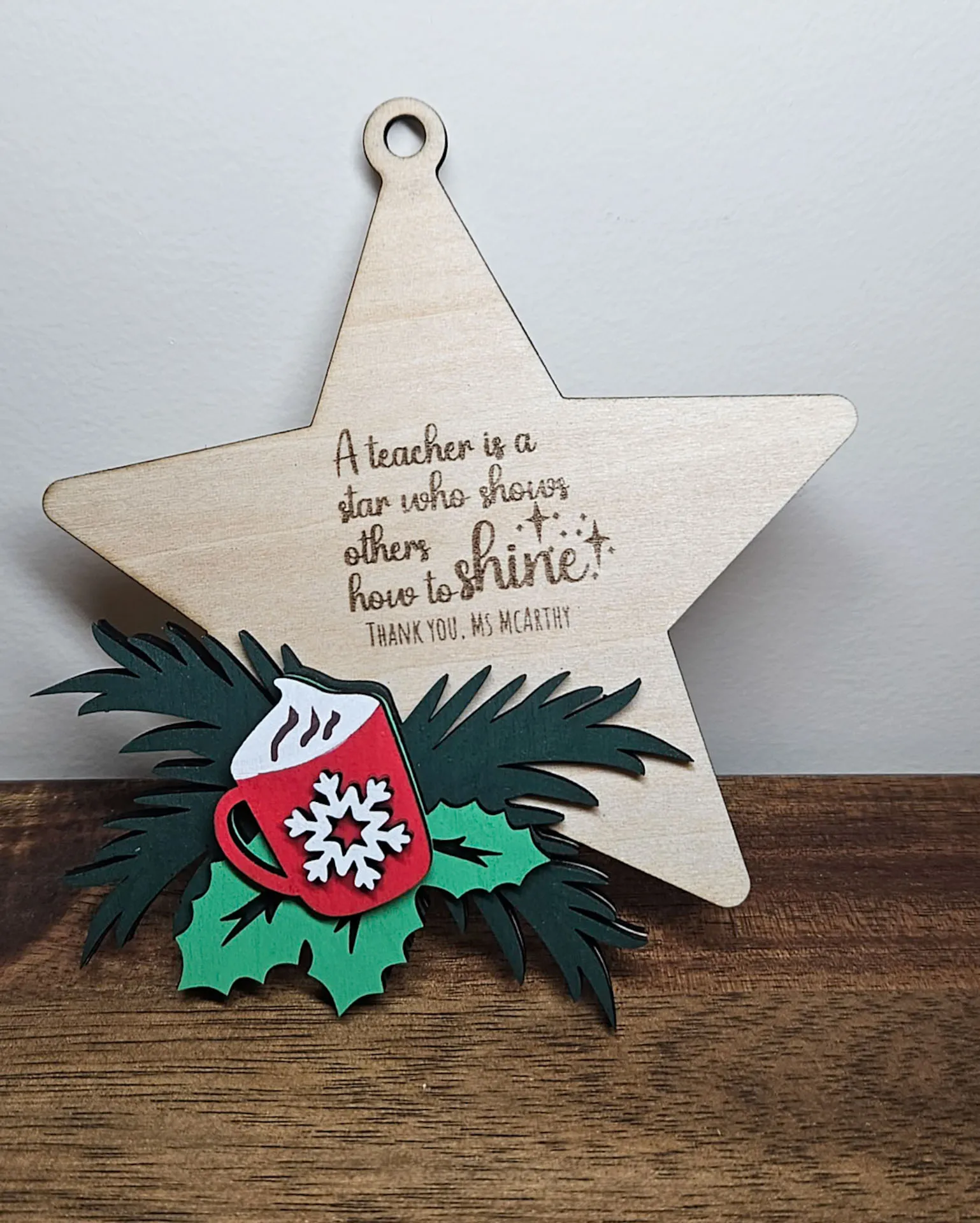 Timber star ornament engraved A teacher is a star who shows others how to shine, with a layered hot cocoa mug and holly design