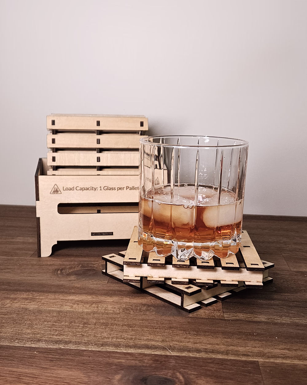 Timber pallet-style coasters stacked in a matching miniature crate