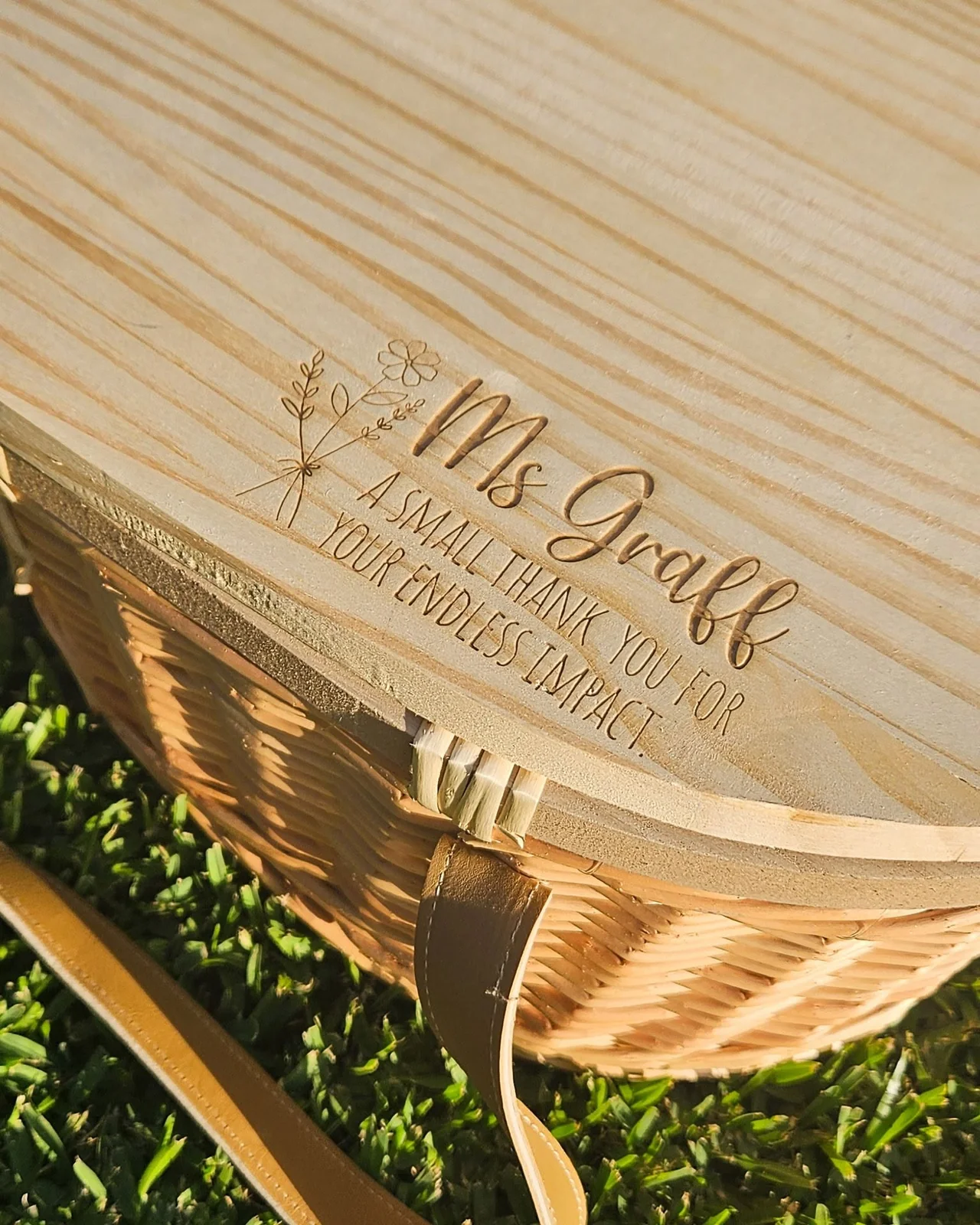 A picnic basket engraved with a thank you message for a teacher, Ms Graff