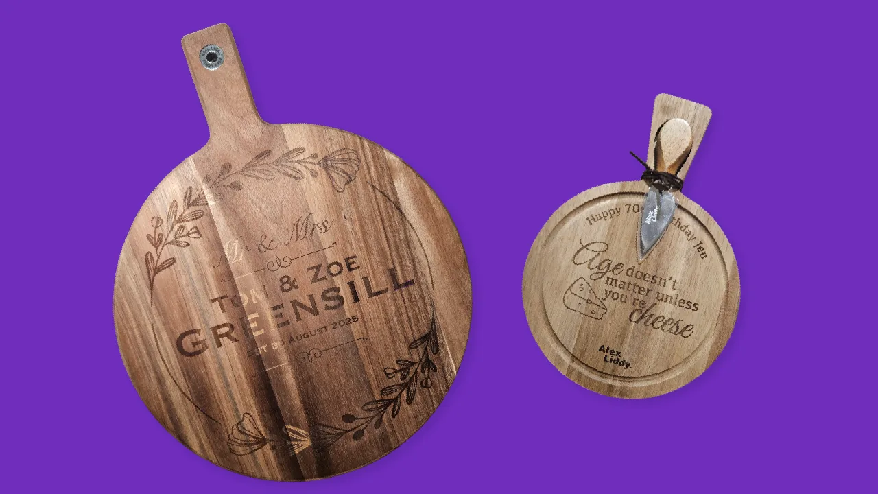 An engraved timber paddle board and a round board, both personalised with a family name