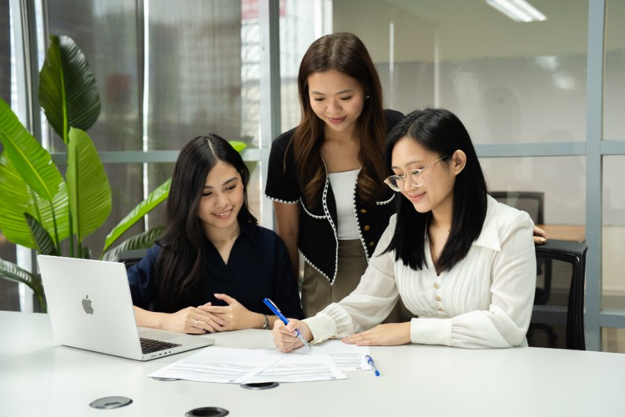 A CloudCFO accounting team reviewing client records together
