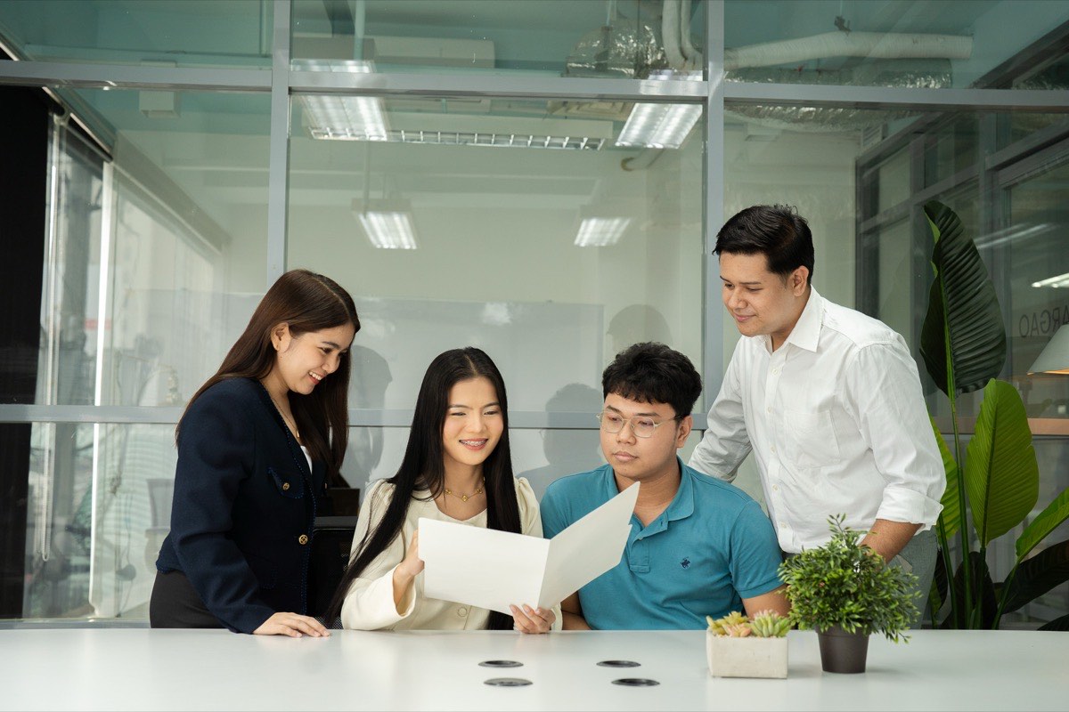 CloudCFO payroll specialists checking a payroll register