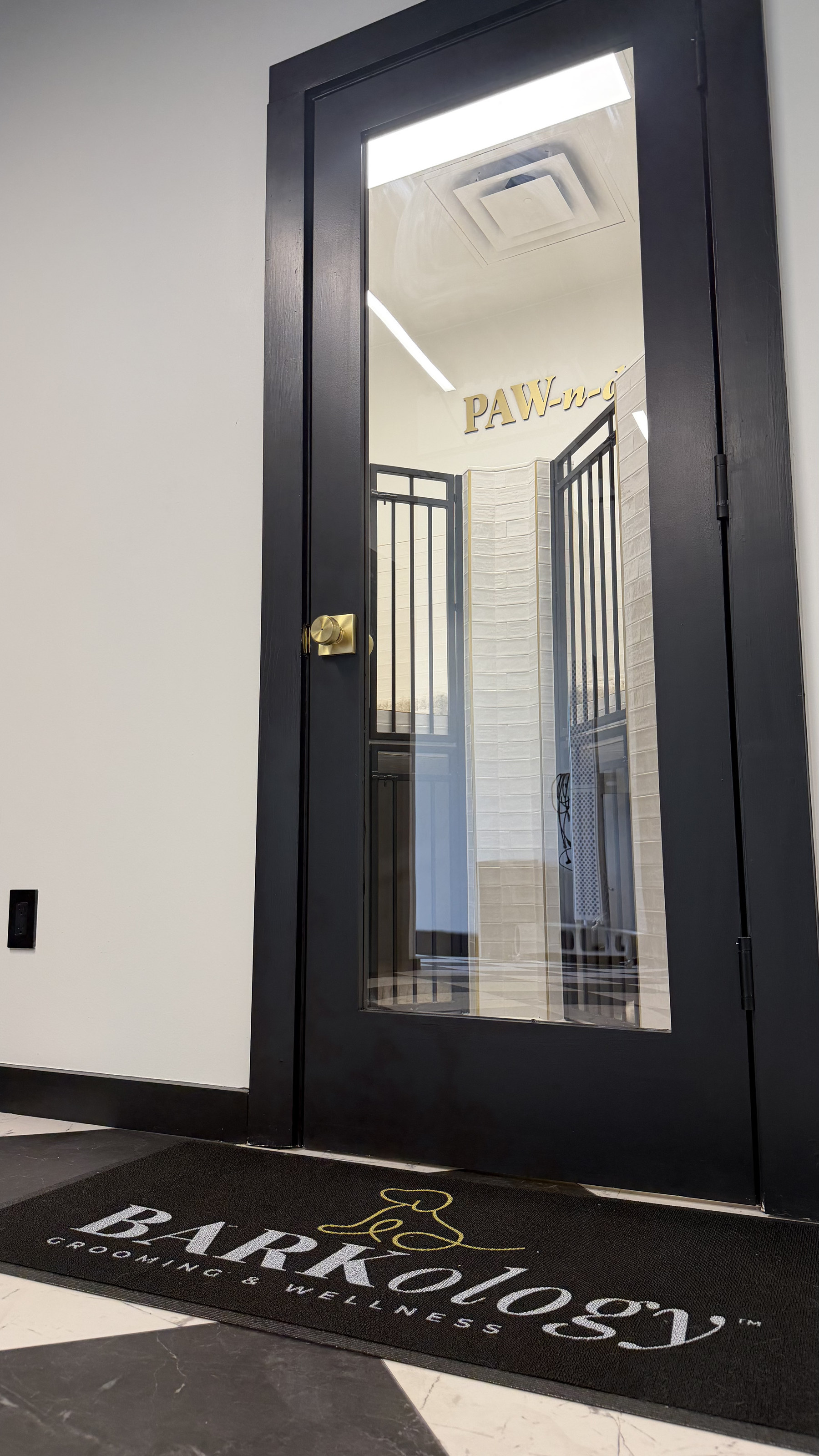 Entrance to a PAWNdo suite at BARKology South Tampa