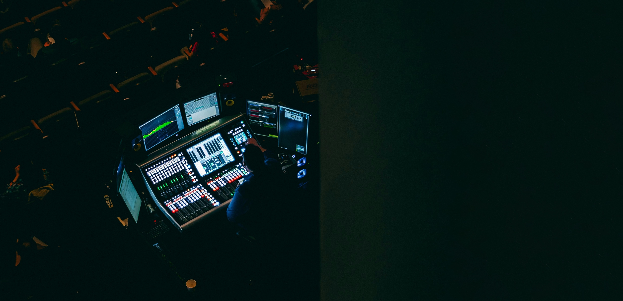 Operator working at a professional media production control desk