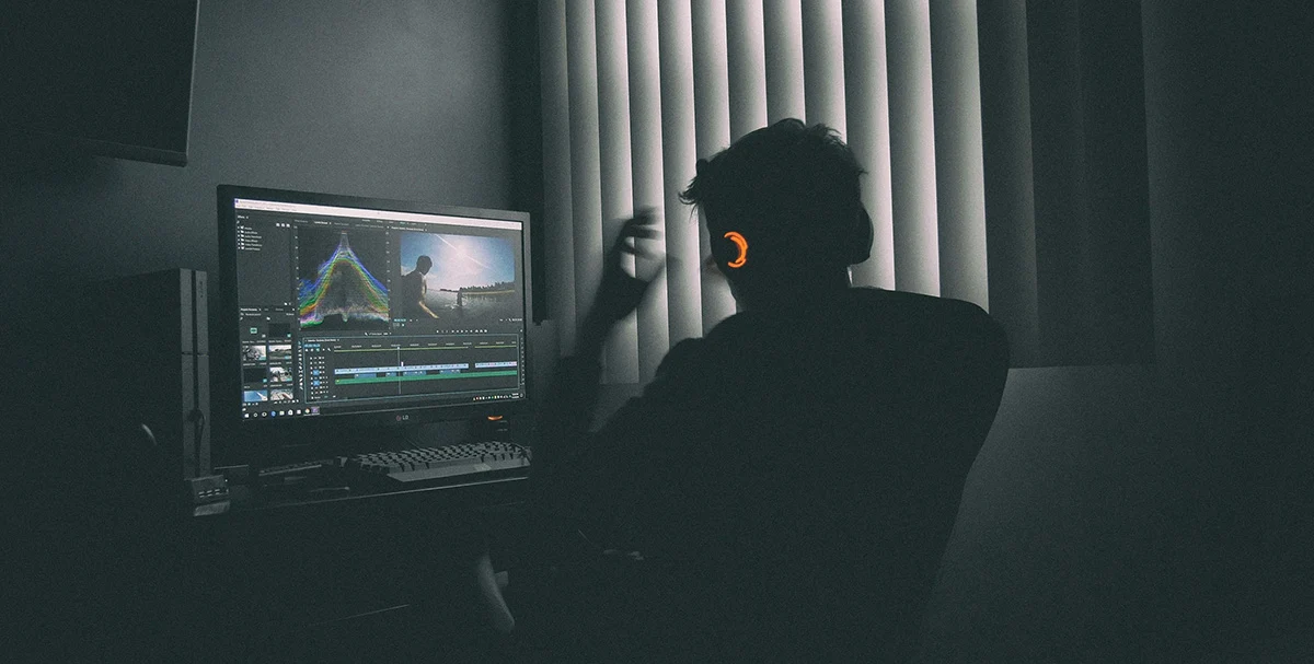 Operator working at a professional media production control desk