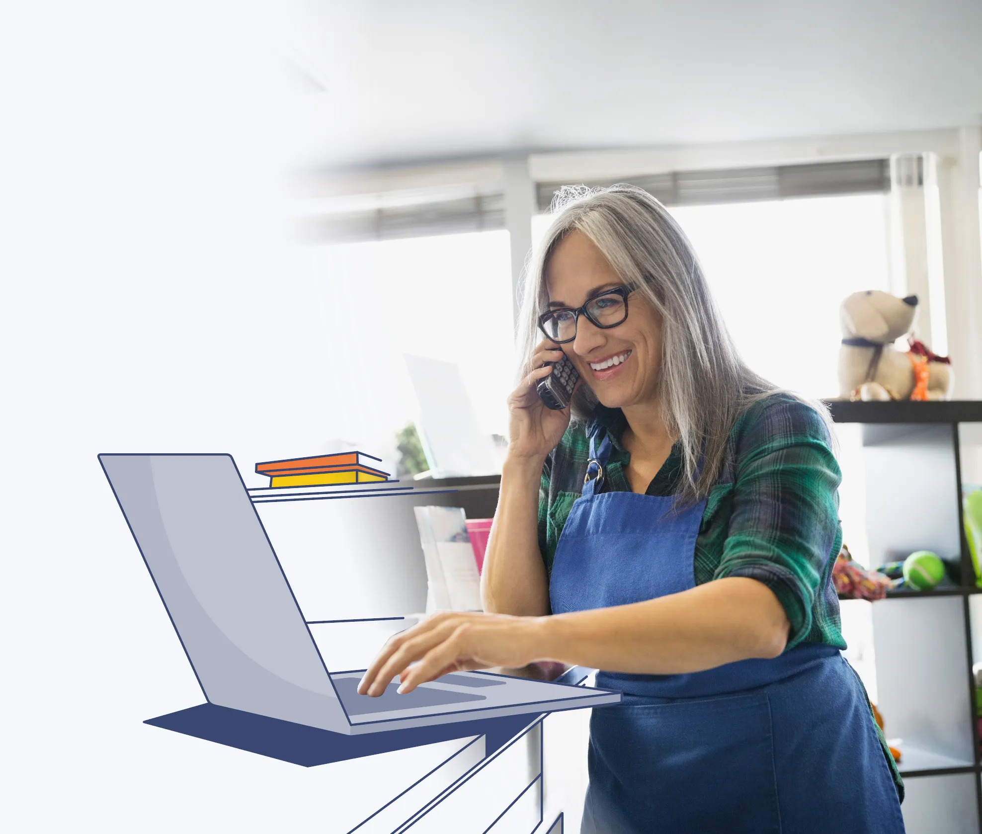 a woman at work, looking at her laptop, smiling