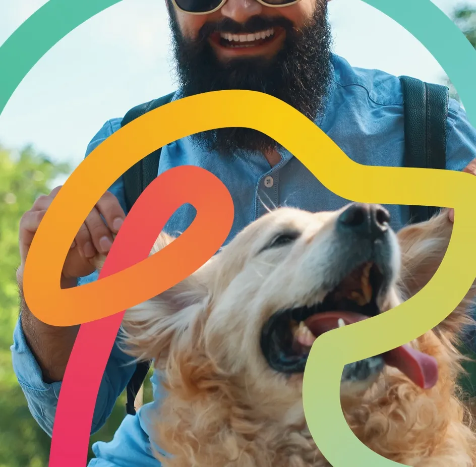 A smiling man petting a happy golden retriever outdoors, framed by the Time To Pet logo swoosh