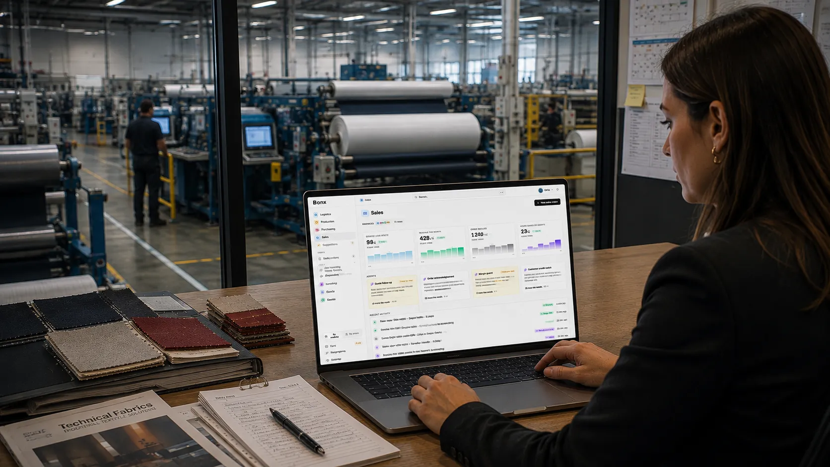 A woman viewing the Bonx sales dashboard on a laptop at a textile factory office.