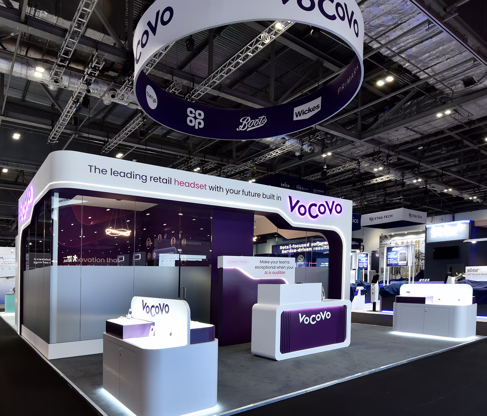 Vocovo exhibition booth with signage promoting retail headset and AI technology at a trade show.