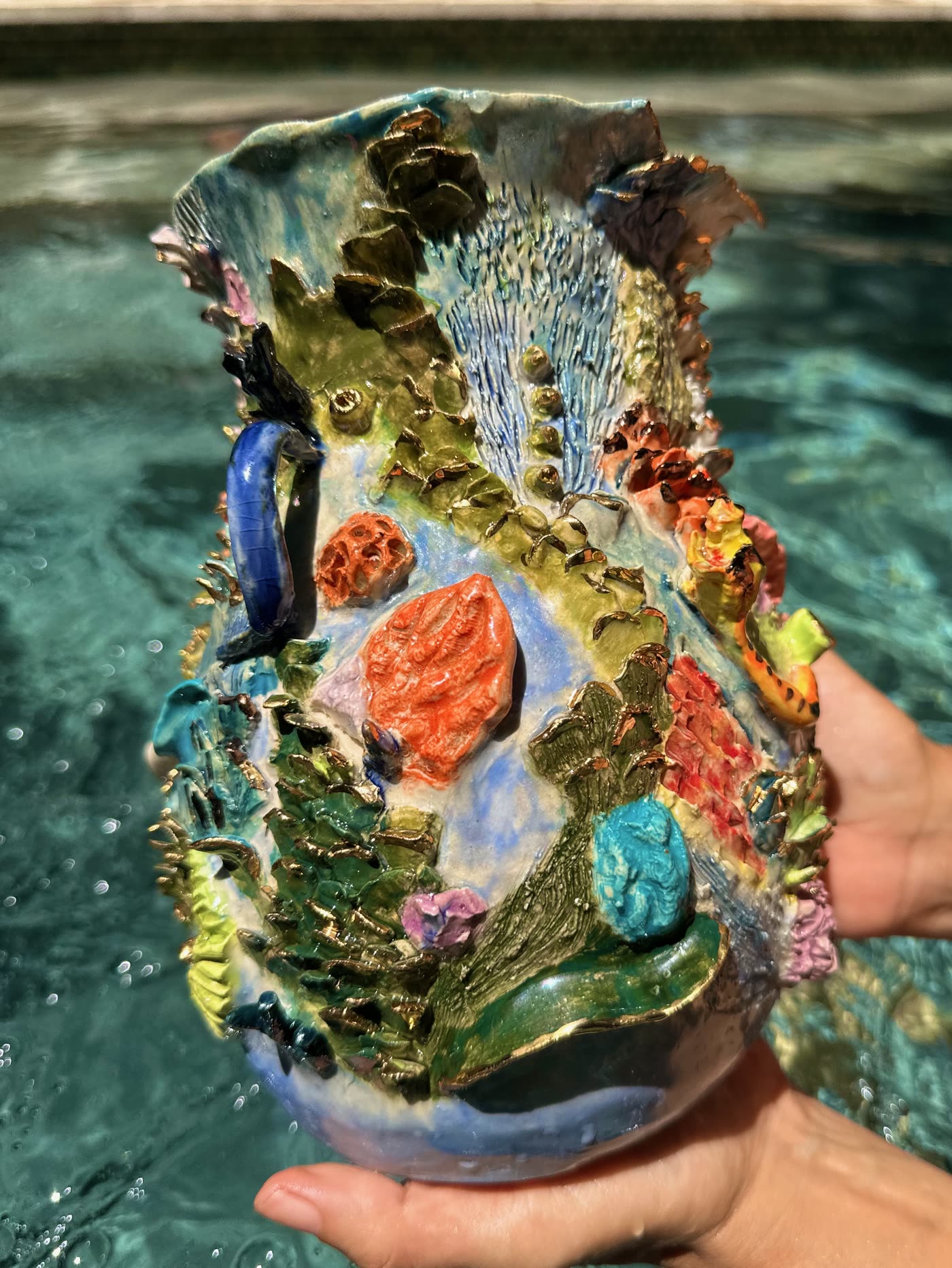 Coral reef ceramic vessel by Consuelo Becerra showing modelled kelp, anemones and fish in coloured glazes, view 2 of 5
