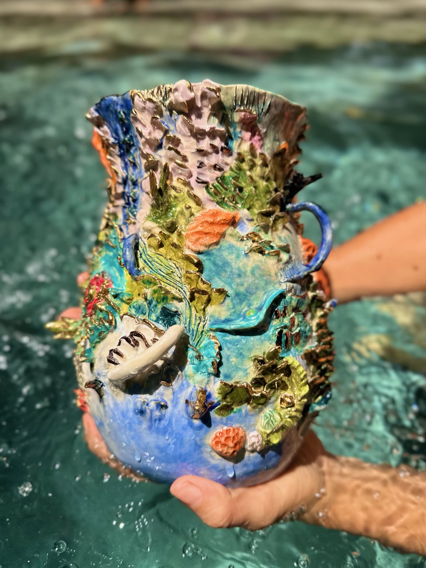 Coral reef ceramic vessel by Consuelo Becerra with a modelled handle and encrusted rim, view 4 of 5
