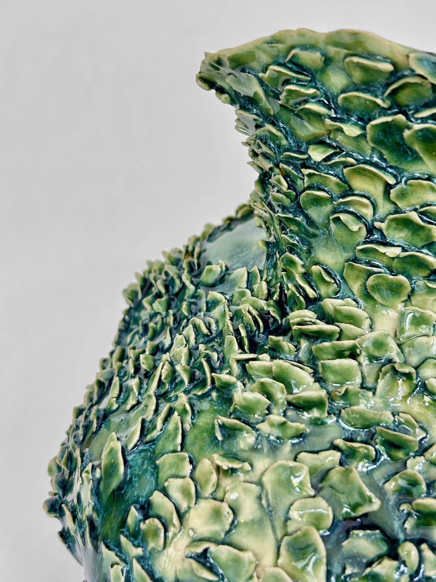 Detail of the reptilian scale texture and green glaze on the vessel by Consuelo Becerra, view 6 of 6