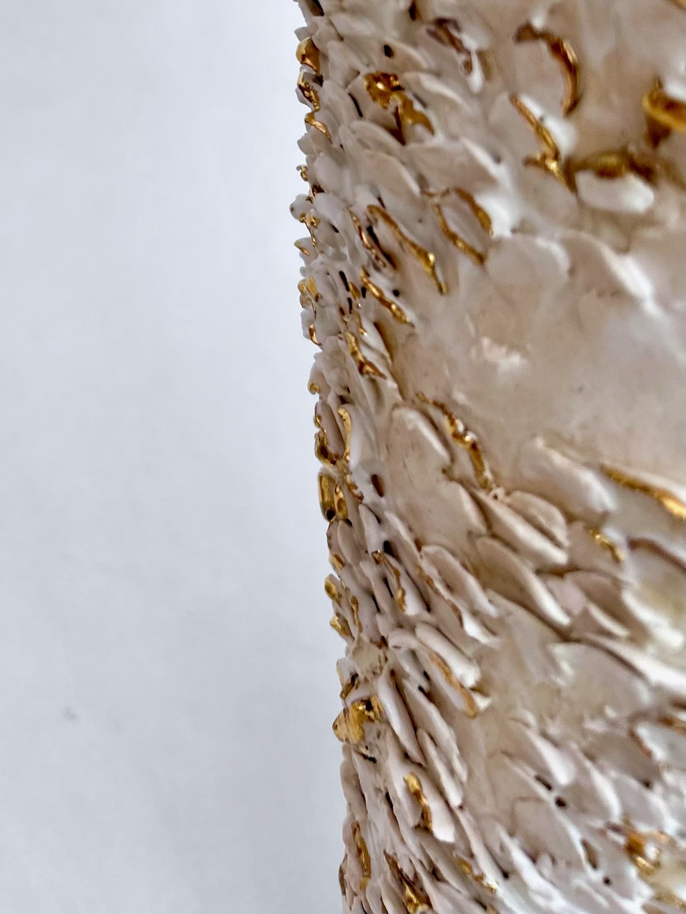 Macro detail of the gold lustre running between the white applied fragments, by Consuelo Becerra, view 8 of 8