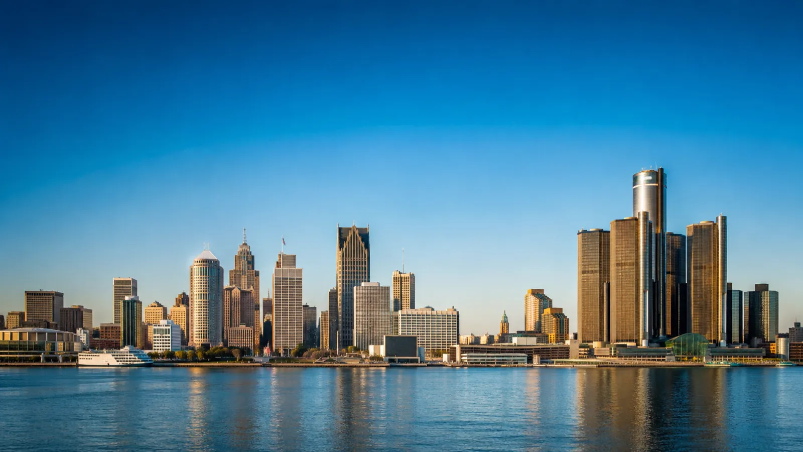 Detroit skyline at golden hour across the river