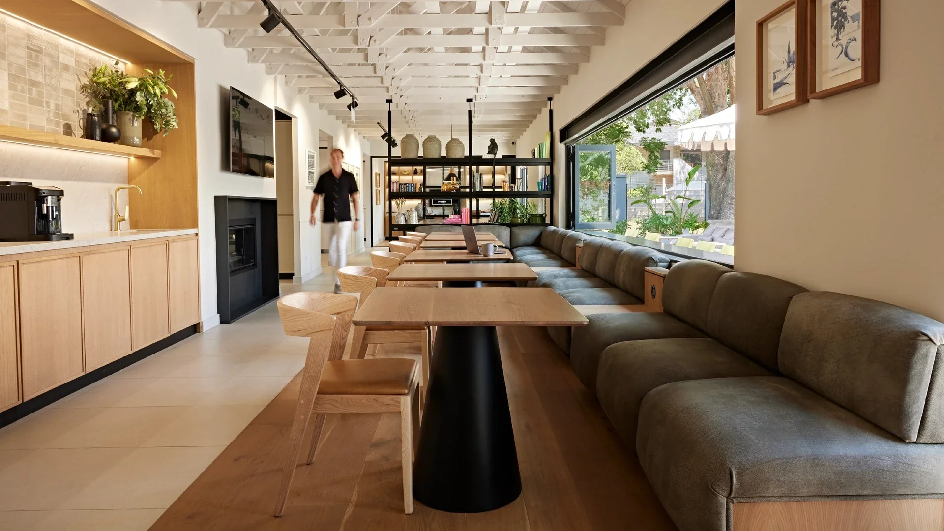 The Design Partnership design studio in South Africa - lounge with banquette seating, coffee bar and garden outlook design in Johannesburg.