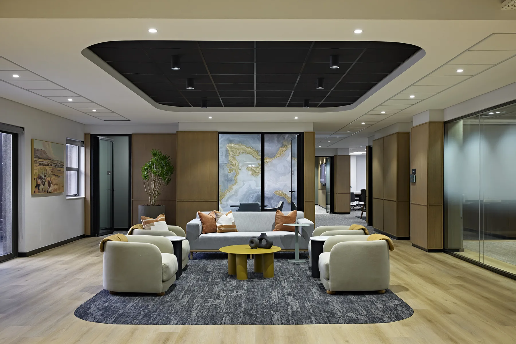 Gold Fields workplace lounge with soft seating beneath a feature ceiling, designed by Design Partnership.