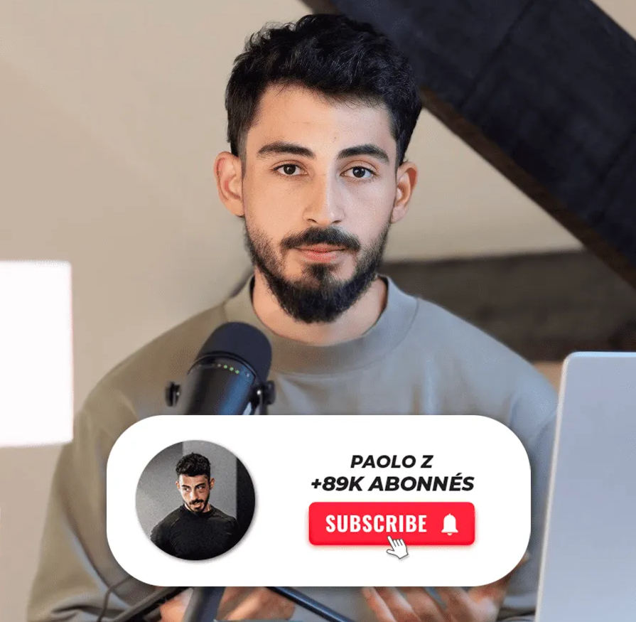 Un homme avec barbe et cheveux noirs regardant la caméra devant un microphone et un ordinateur portable, avec une invitation à s'abonner affichée montrant « PAOLO Z +89K ABONNÉS » et un bouton rouge « SUBSCRIBE » accompagné d'une icône de cloche.