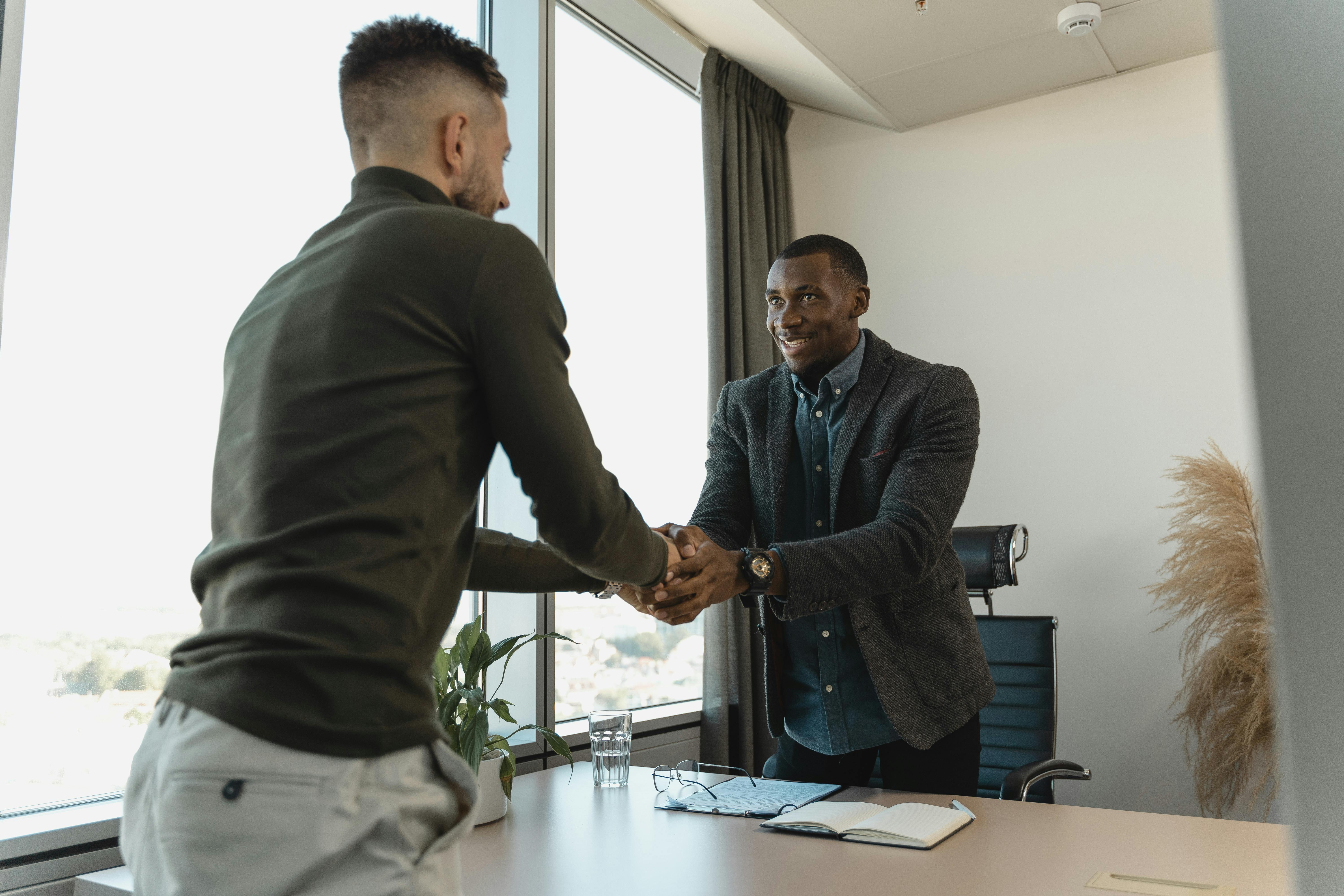 Two men shaking hands stock image