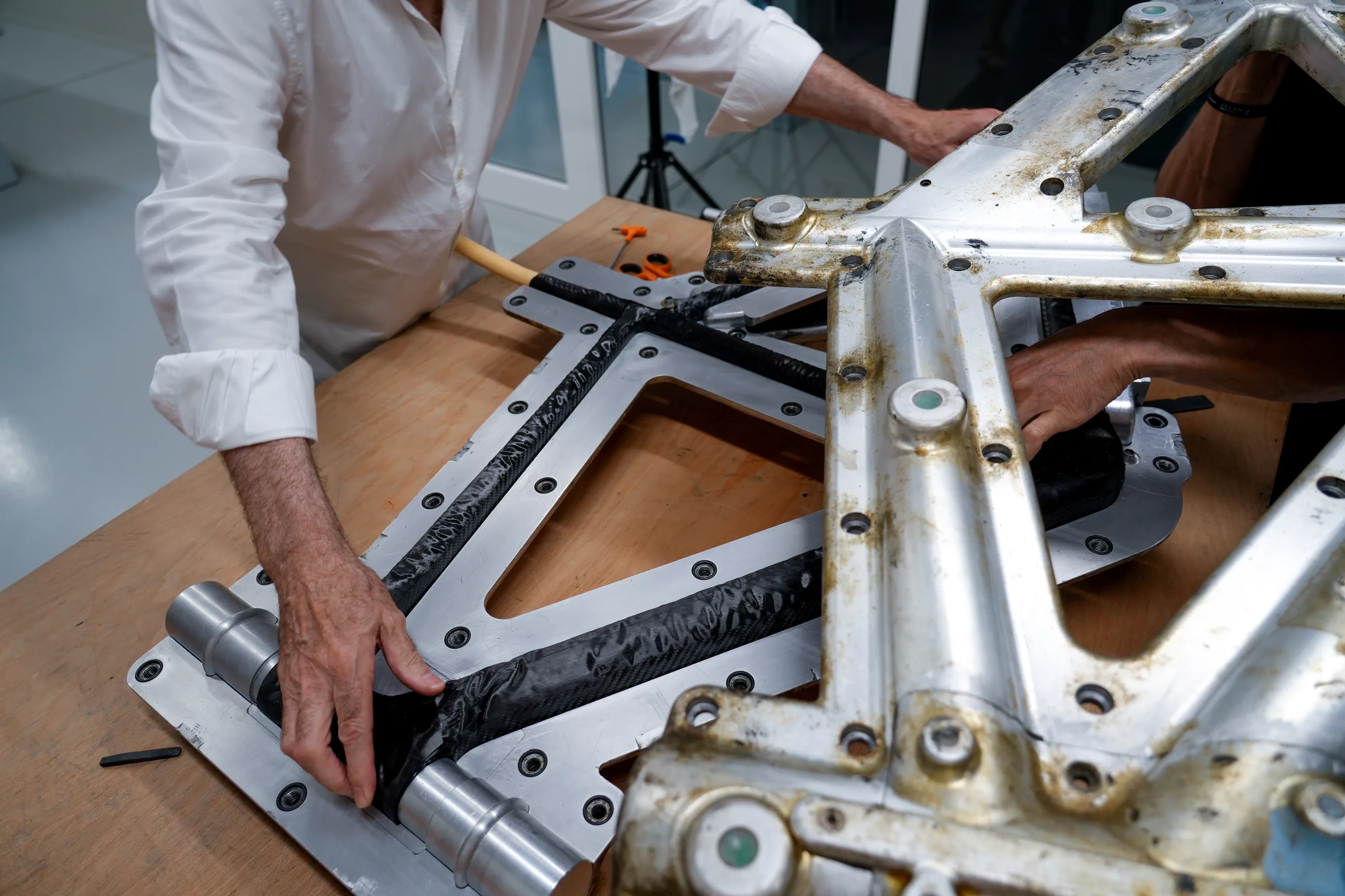 Carbon being laid by hand into an aluminium frame mould at the SWI workshop