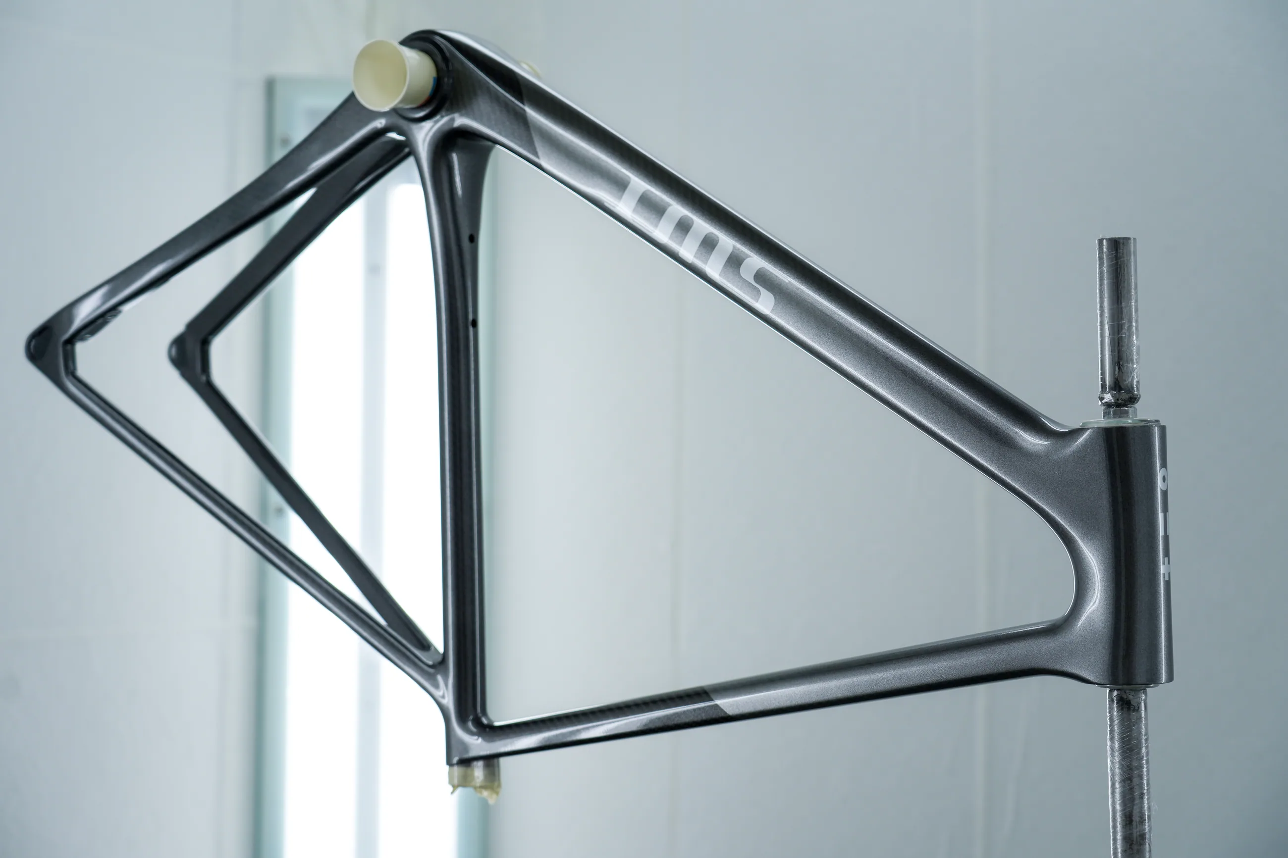 A cured SWI frame hanging in the paint chamber