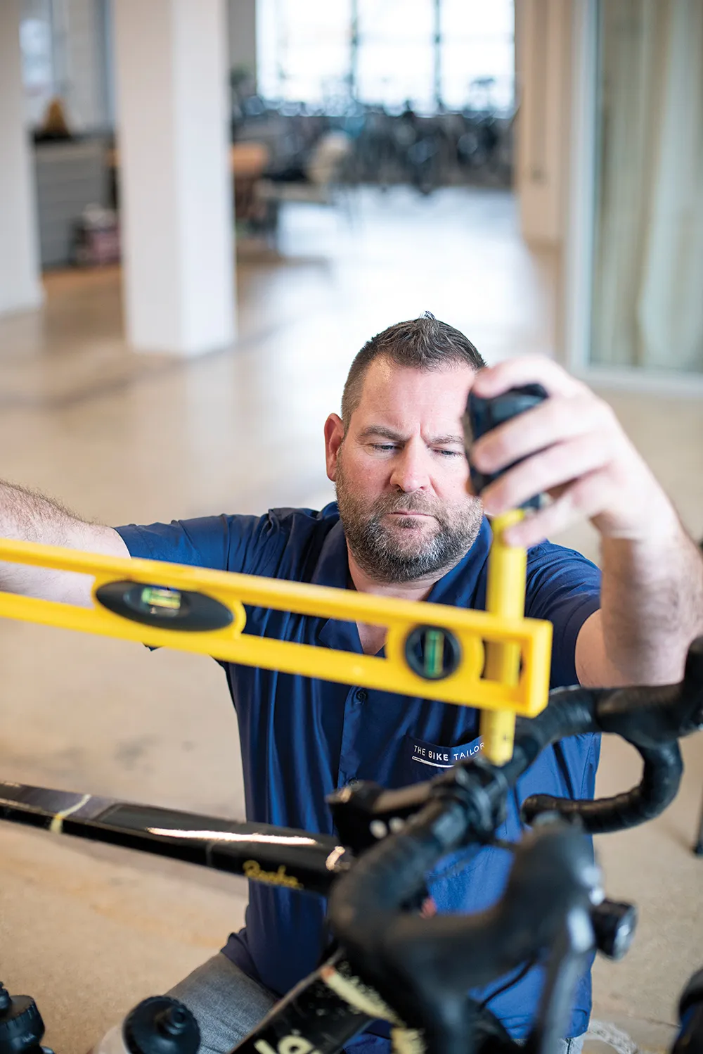 Stephen setting a level across the handlebars