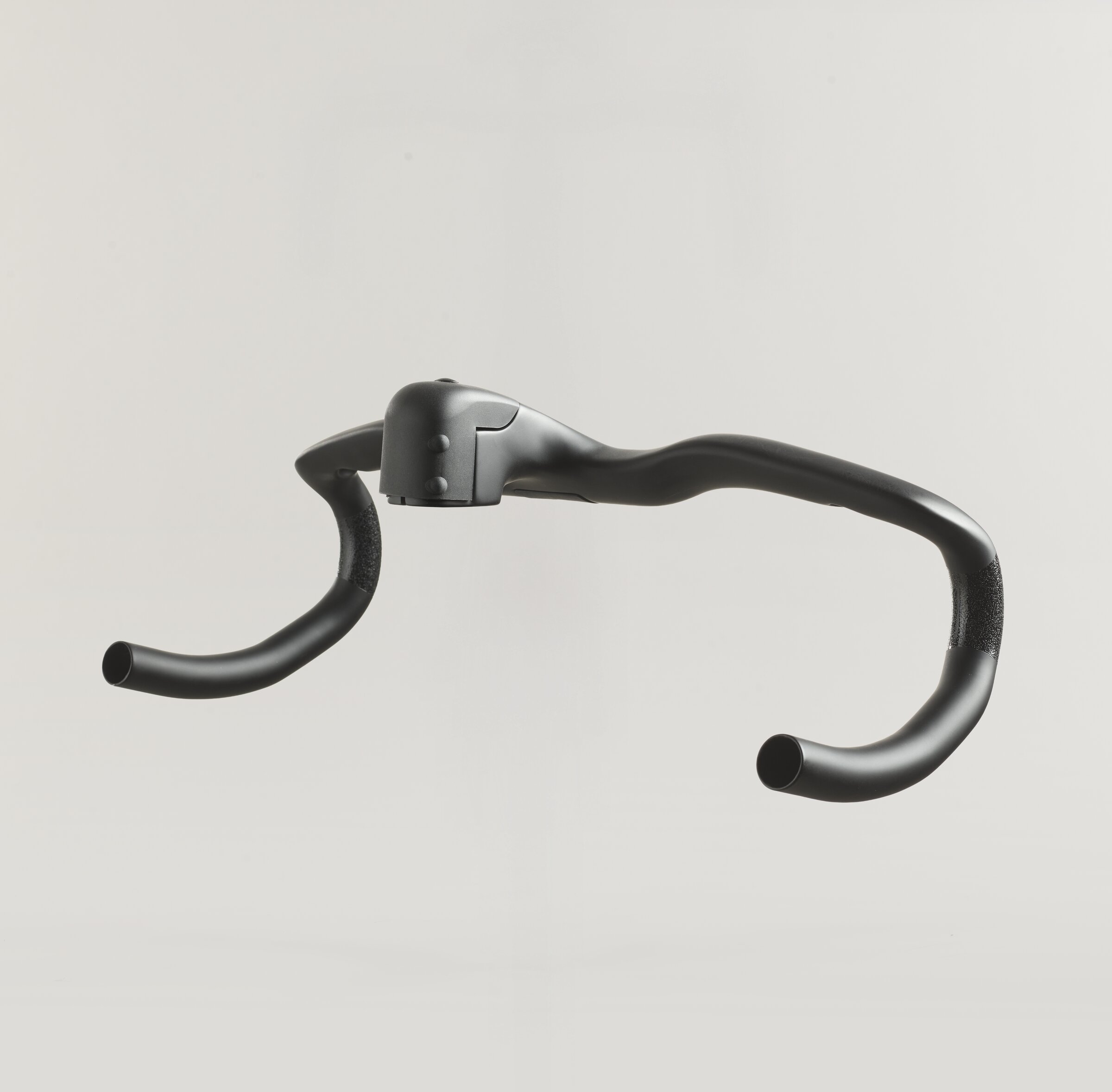 SWI integrated carbon cockpit at an angle, showing the stem and the steerer clamp area