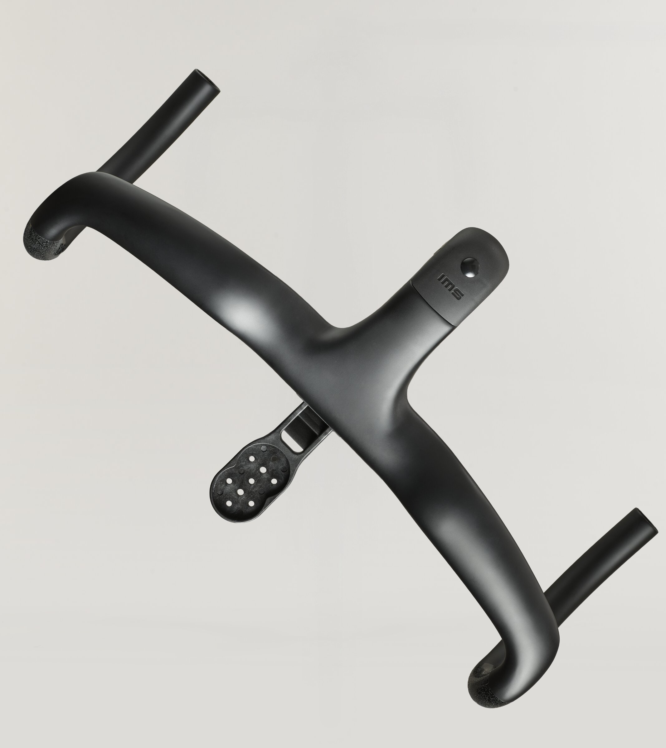 SWI integrated carbon cockpit from above, showing the accessory mount plate and its bolt pattern