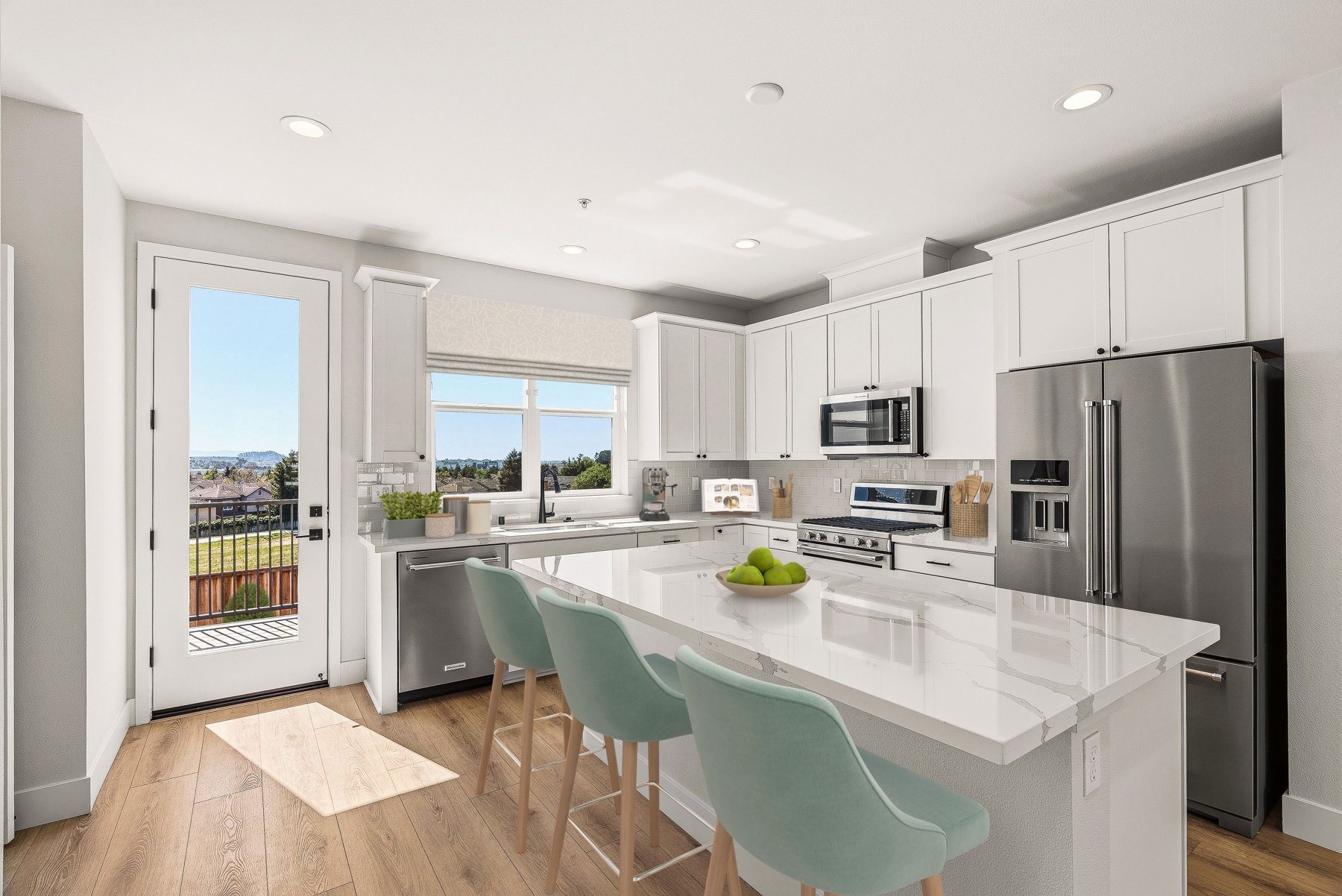 Kitchen at Hillcrest Residences with quartz island, shaker cabinetry, tile backsplash and stainless appliances