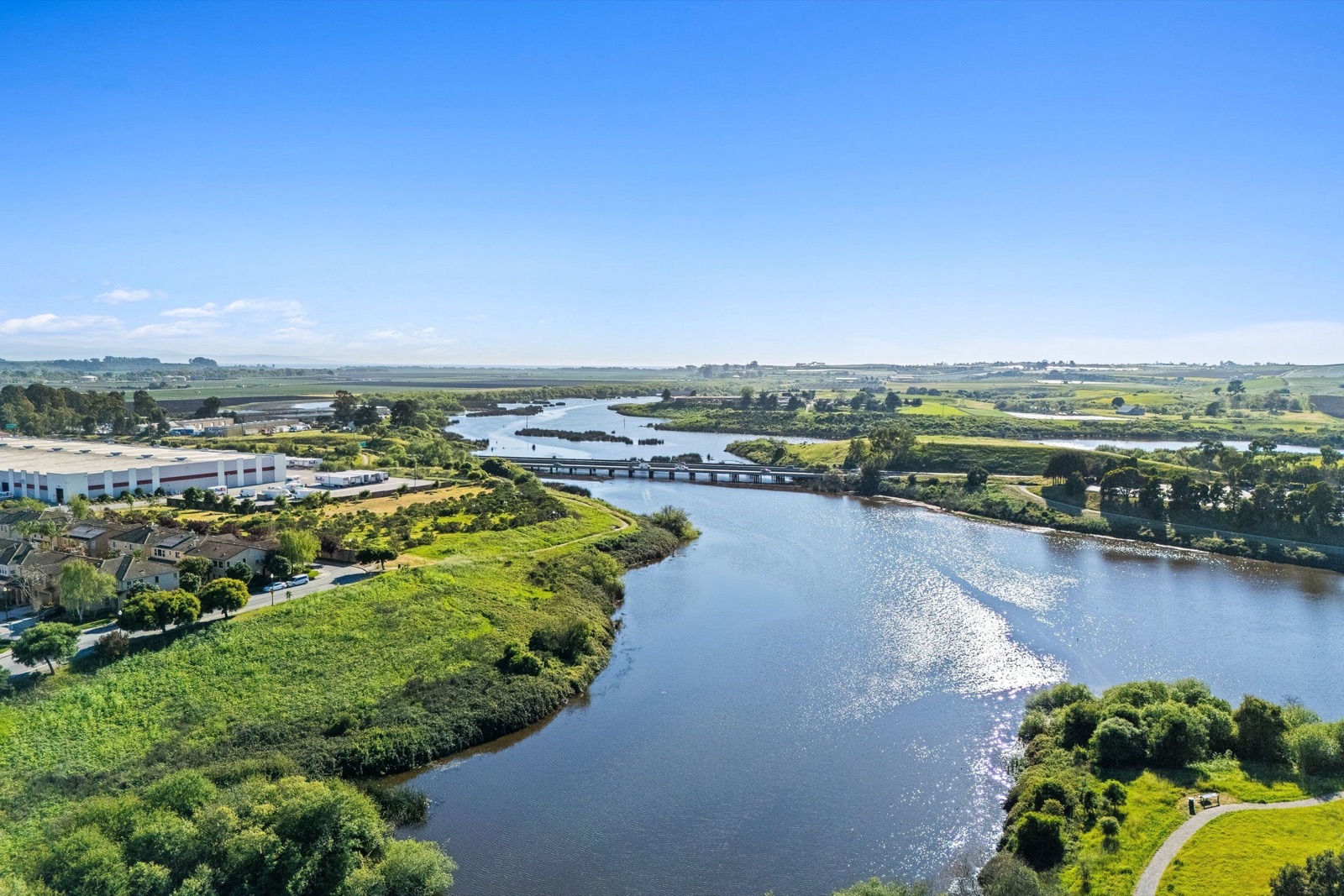 The waterway and walking trail bordering Hillcrest Residences in Watsonville
