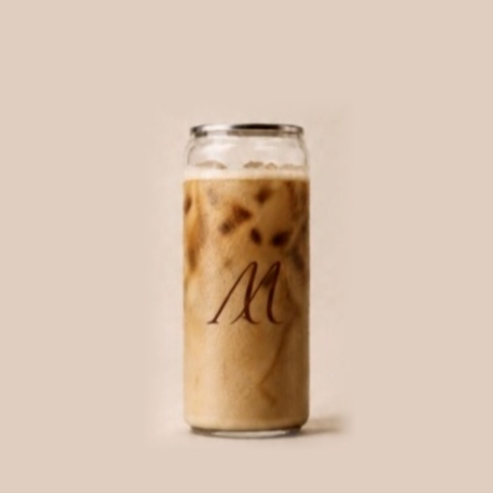 Freddo Americano with cold foam in a Maison Amie can