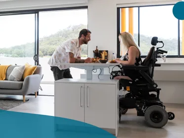 An accessible bedroom with mobility equipment and an adjoining bathroom