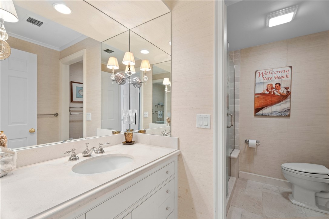Bathroom vanity featuring an integrated sink, polished chrome faucet, and a spacious countertop
