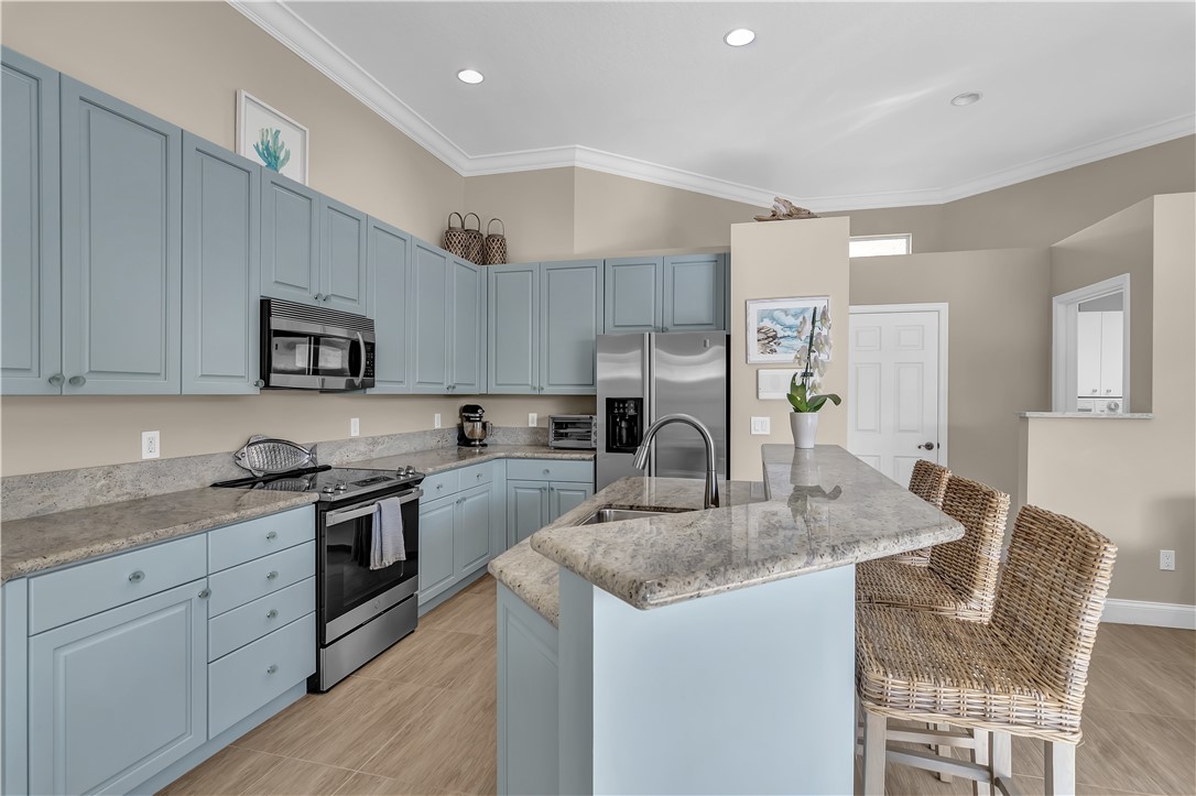 OPEN KITCHEN WITH STAINLESS APPLIANCES