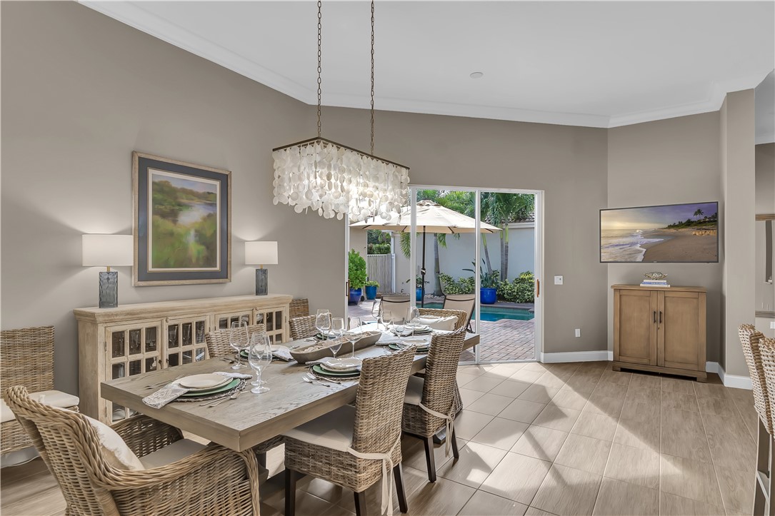 DINING ROOM OFF KITCHEN AND VIEW TO POOL
