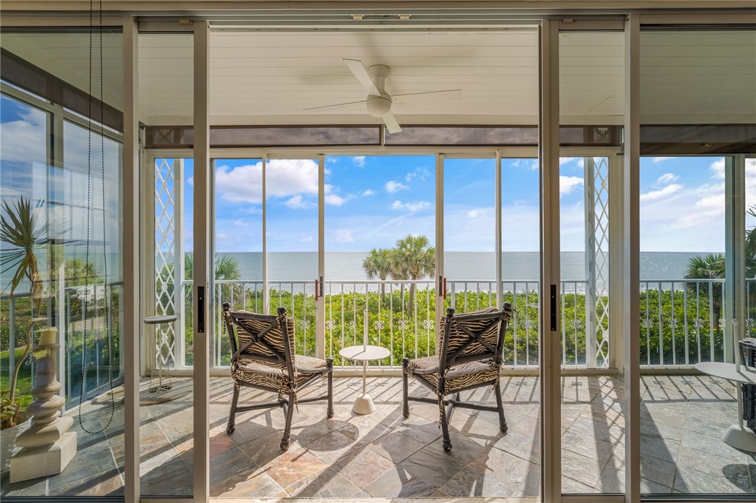 Enclosed patio, ceiling fan, and tile flooring
