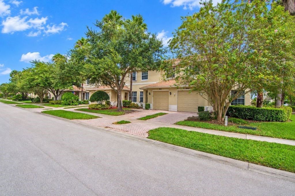 Townhome-style residences with stucco exteriors and attached garages