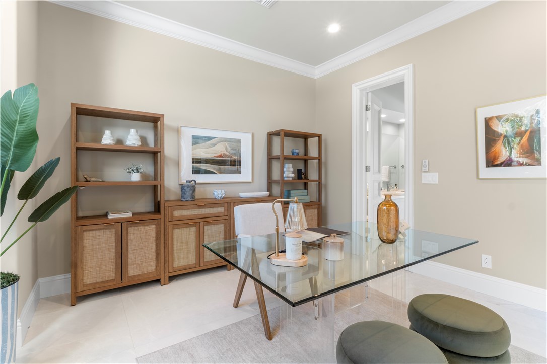 Recessed lighting, crown molding, and tall baseboards